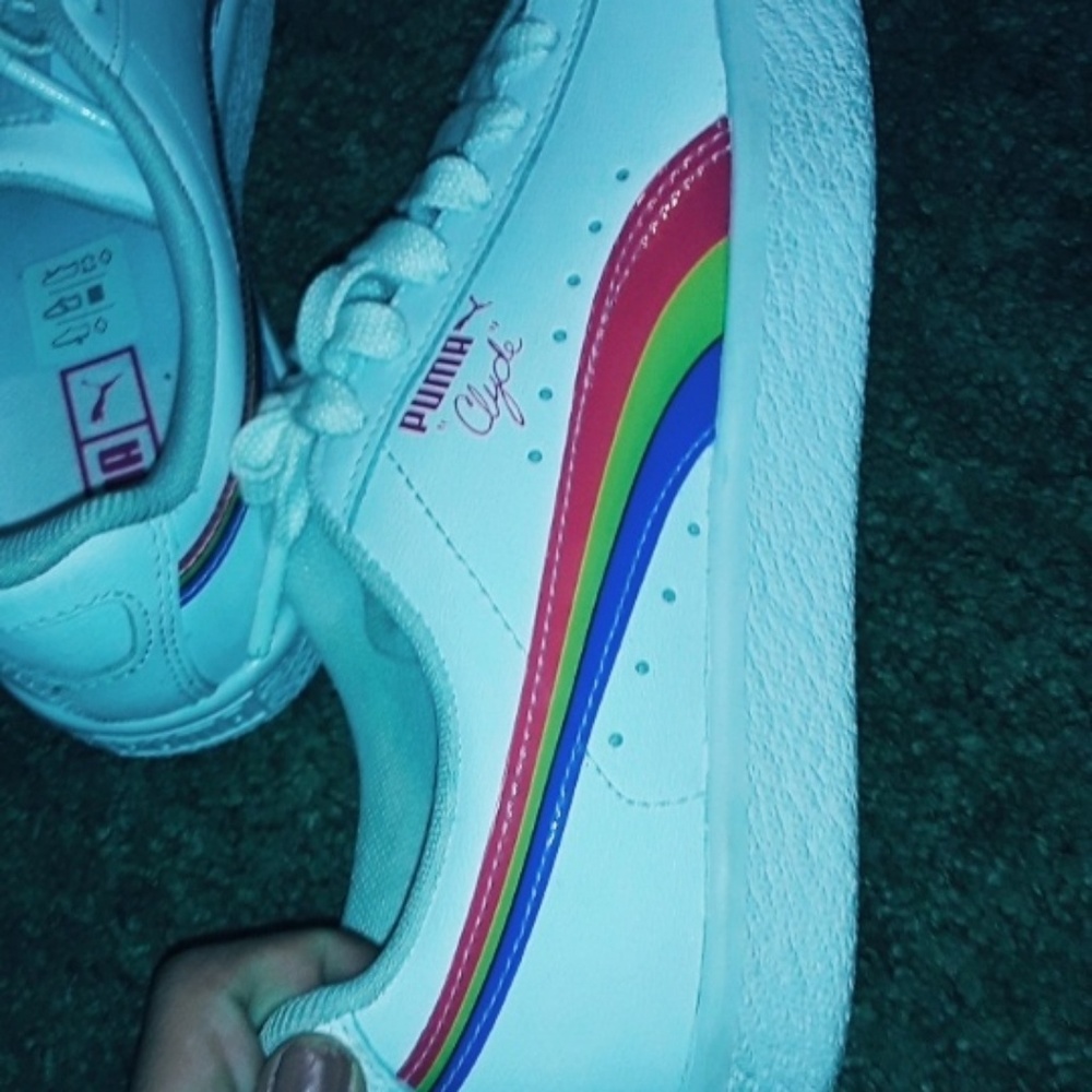 White shoes with Rainbow on the sides.